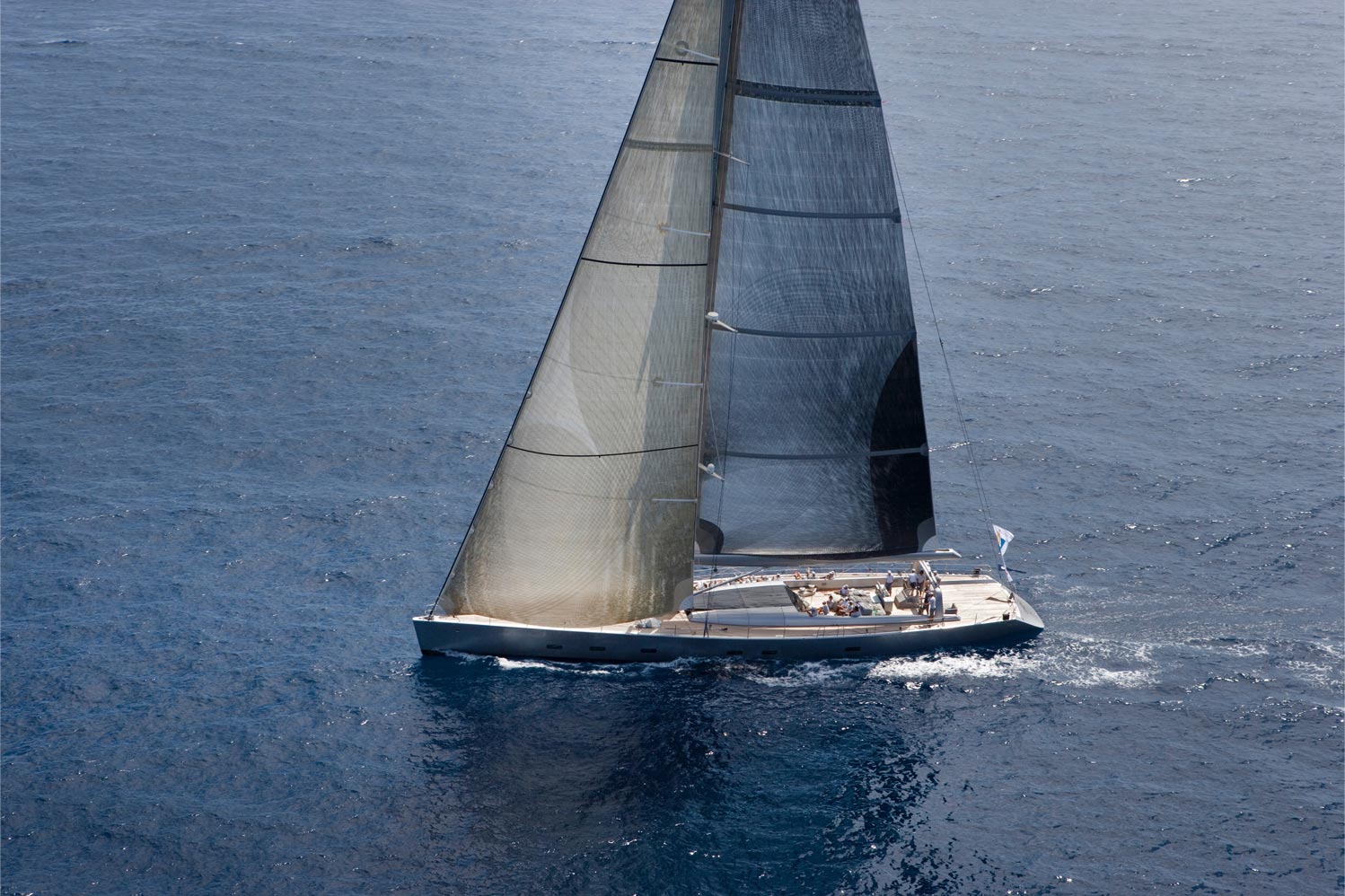 An image of a yacht sailing in sea.