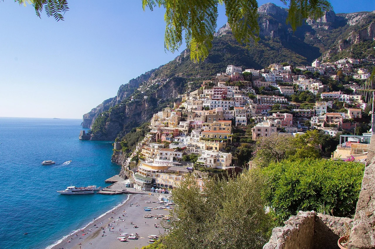 coastal view of the amalfi coast framed by foliage