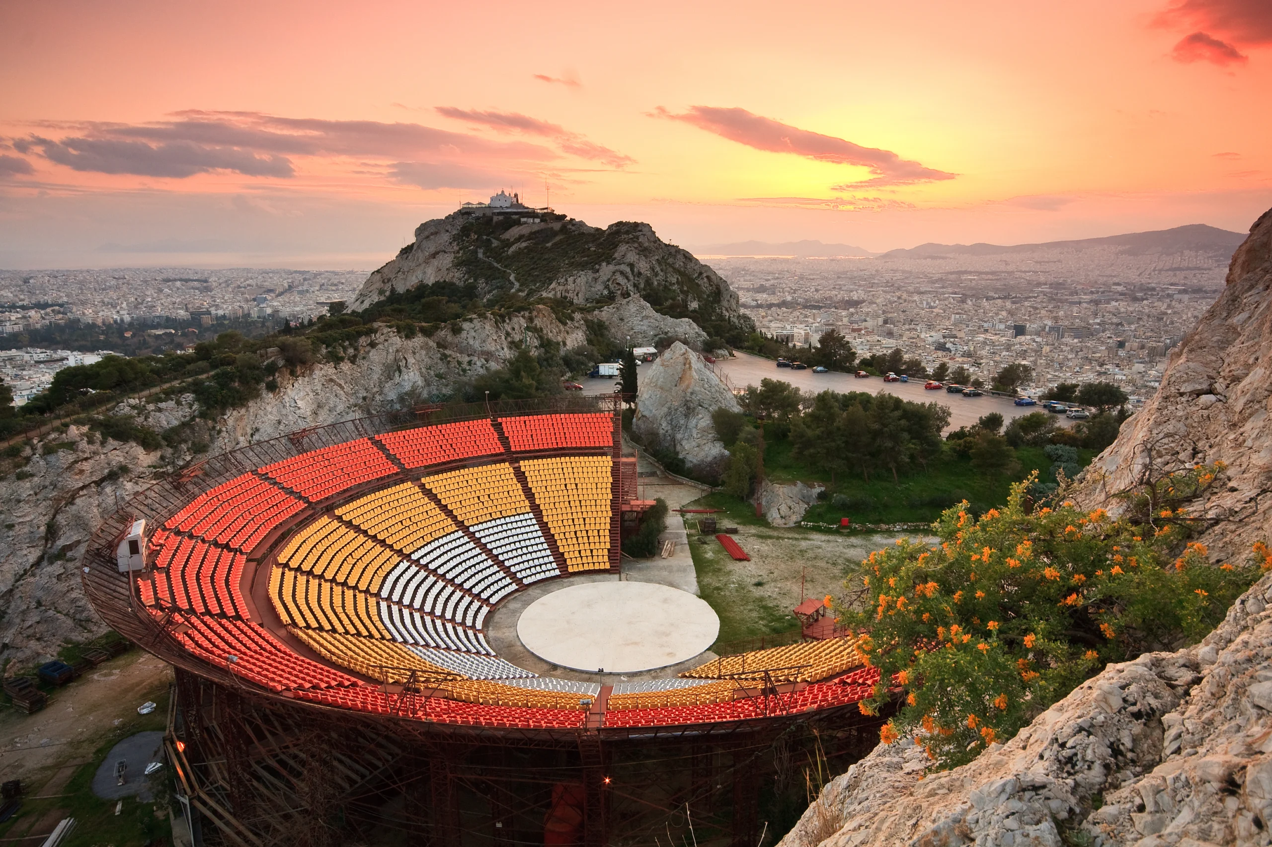 Open air theatre on top of Lycabettus hill and the city of Athens, Greece.