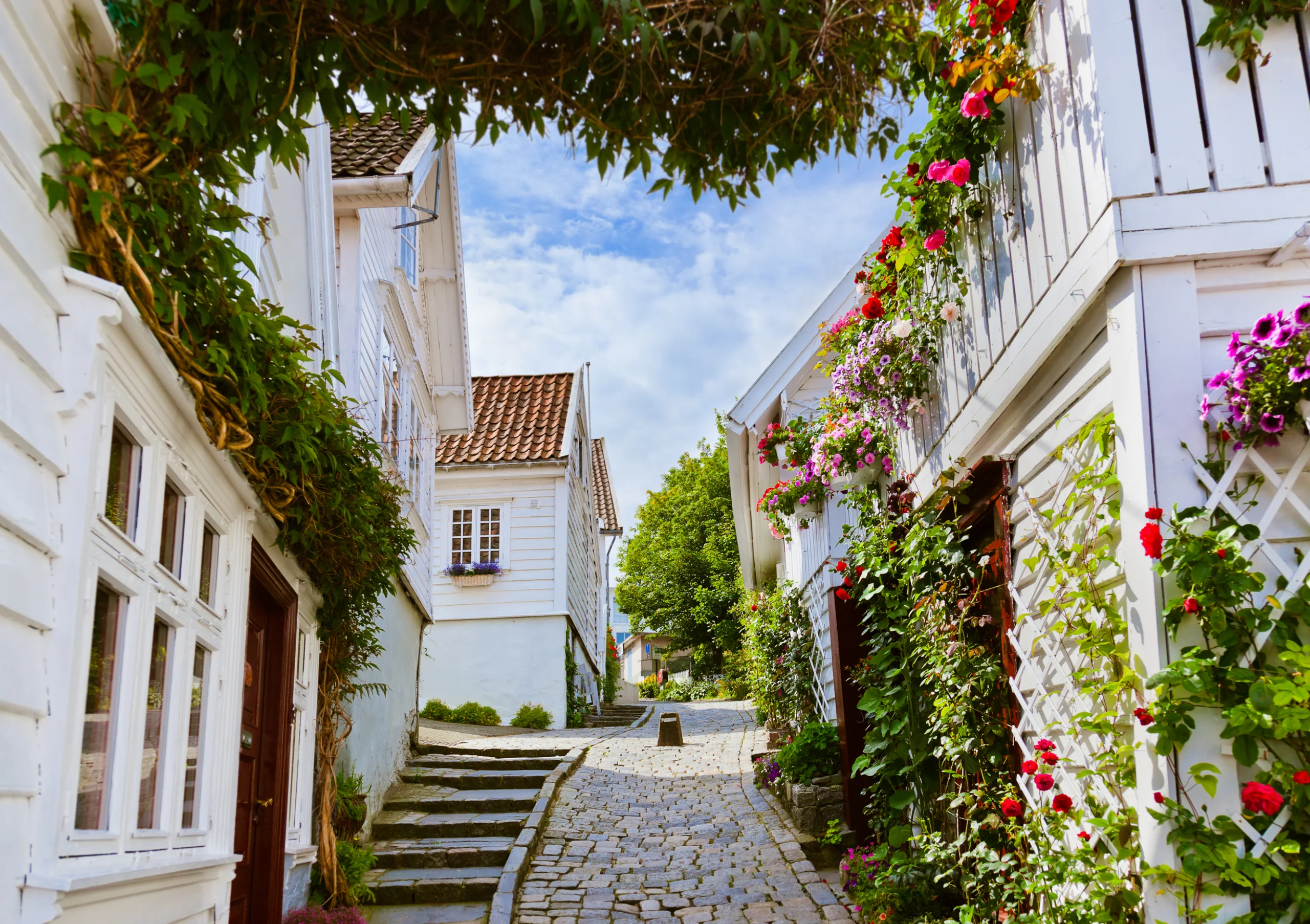 Street with white wooden houses in old centre of Stavanger, Norway, architecture background