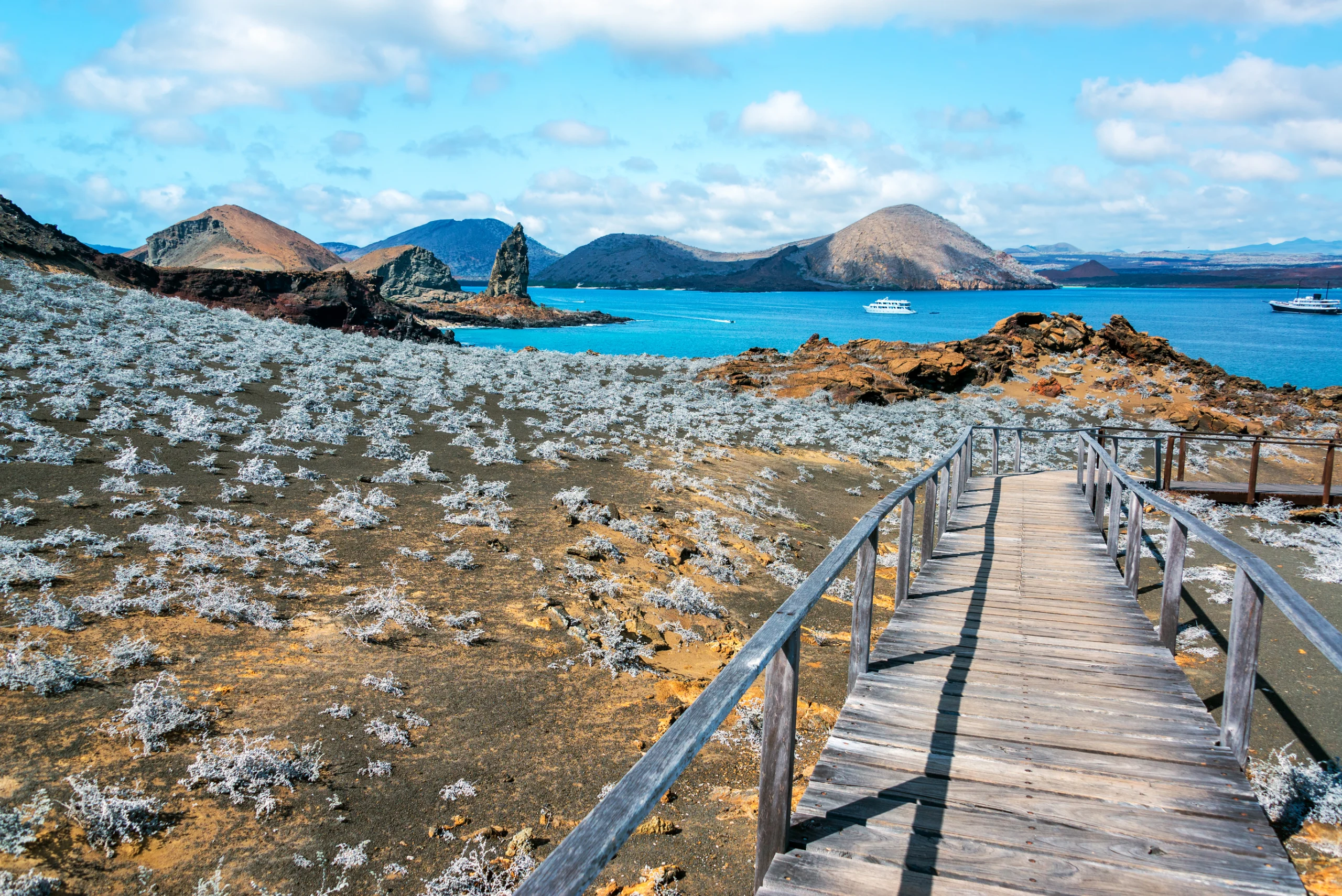 View of walkway on Bartolome Island with Pinnacle Rock in the background in the Galapagos Islands in Ecuador.