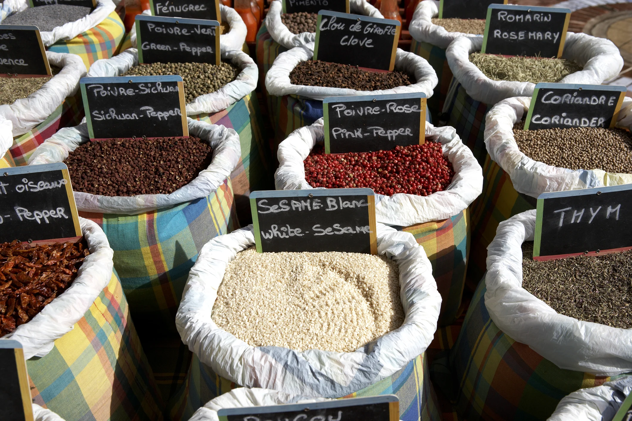 Cooking spices for sale on a market stall Marigot St Martin.
