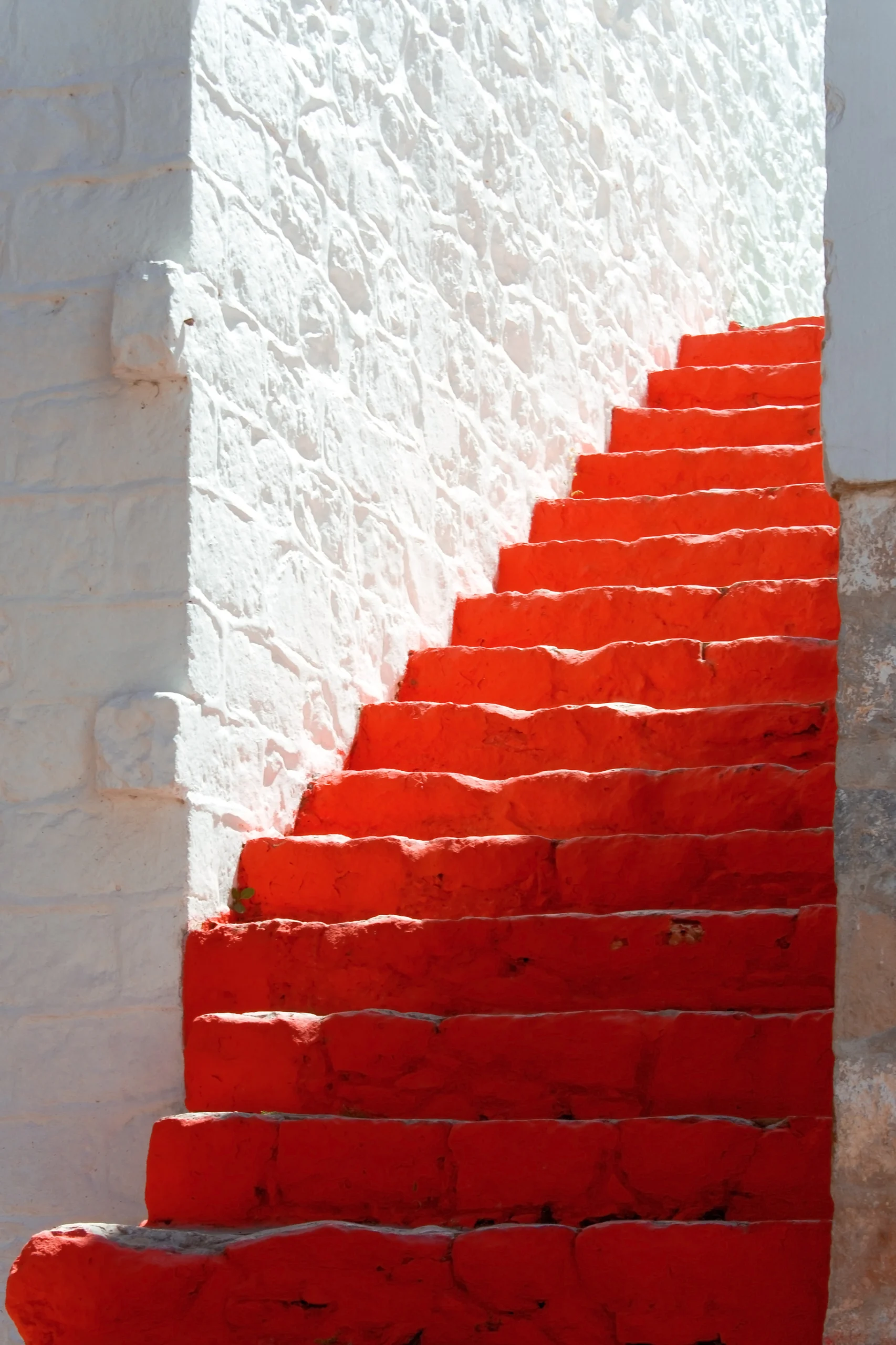 Red steps in a picturesque greek island.