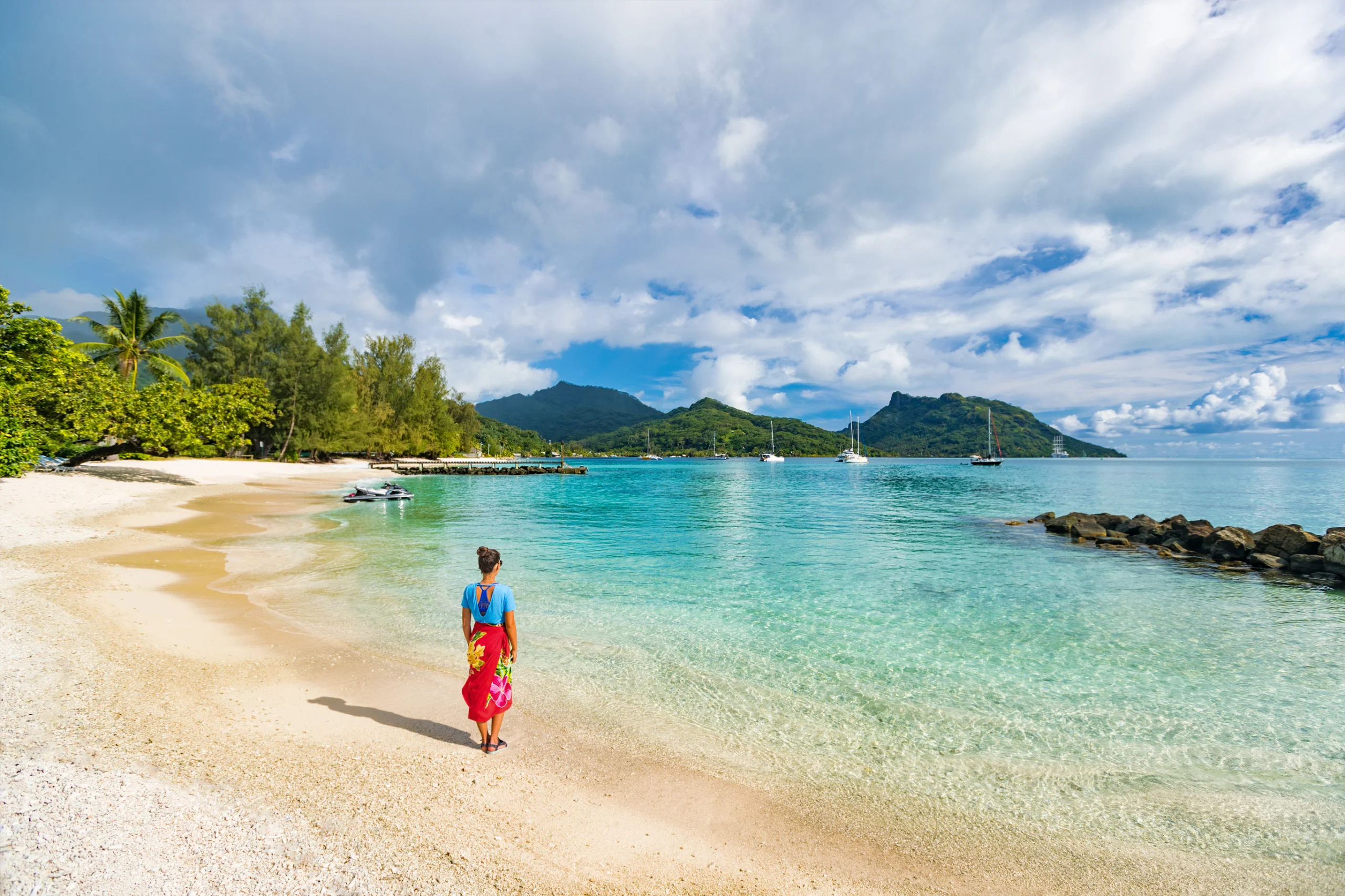 Travel tourist woman at French Polynesia beach on Huahine island cruise excursion on Tahiti holiday vacaton