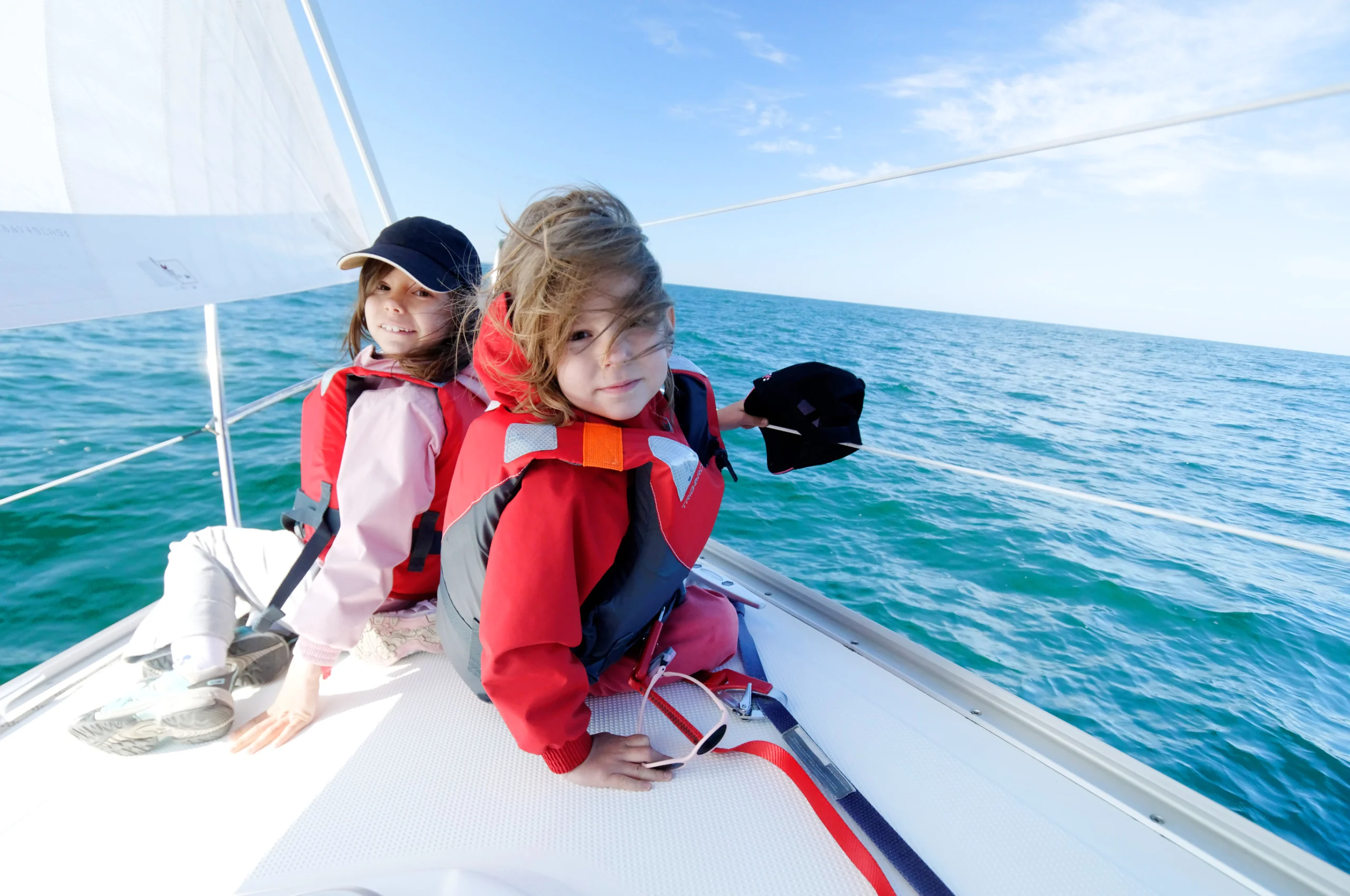 Children sailing on yacht.