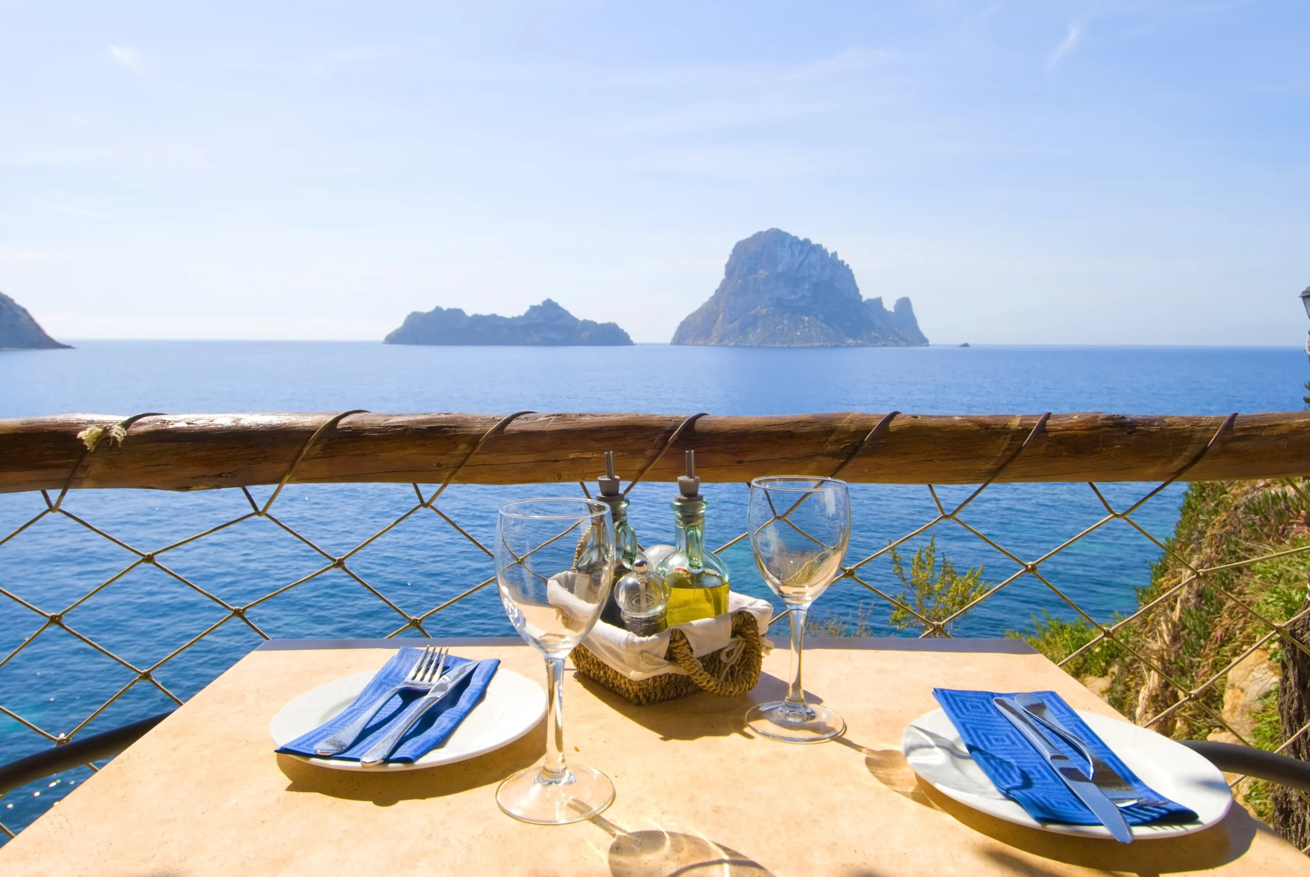 Table with sea view in front of Es Vedra, ibiza, Spain.