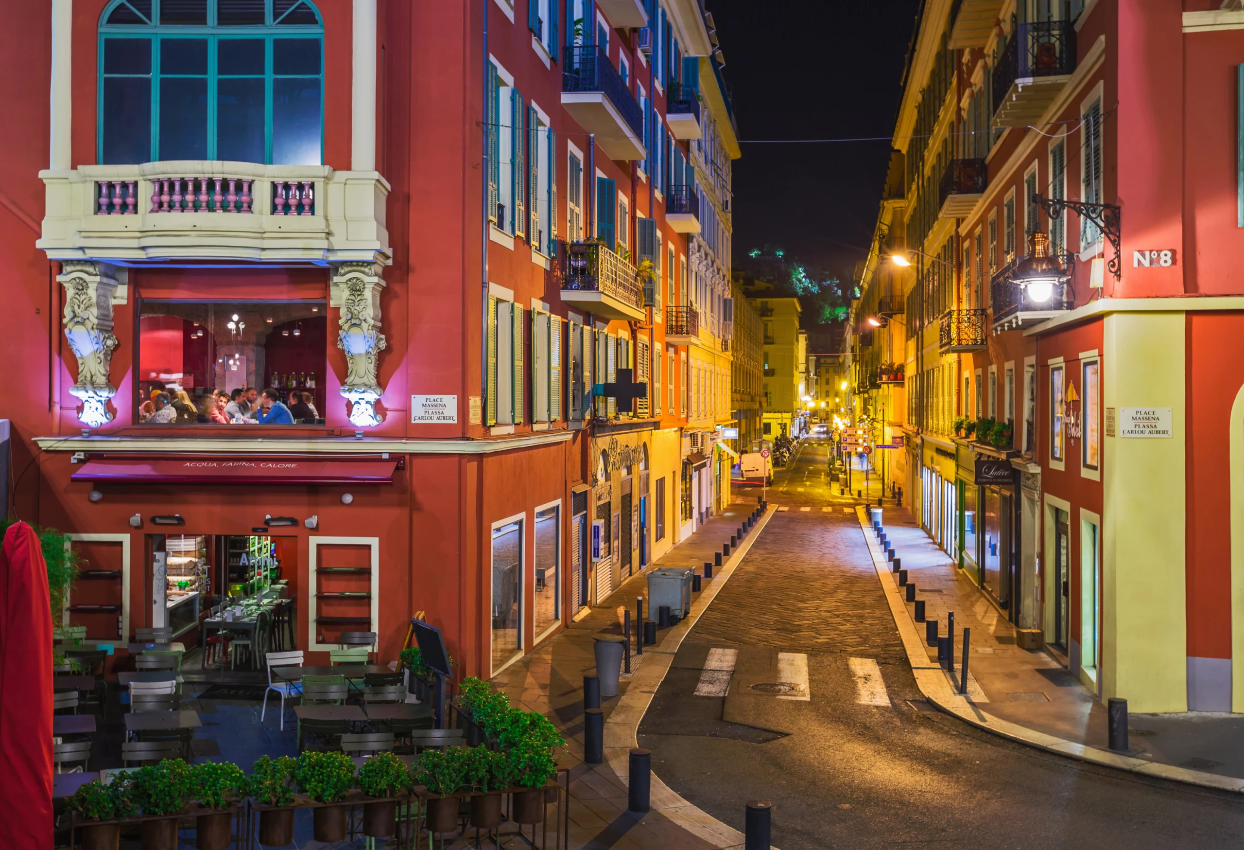 Street cafe in Nice France at night.