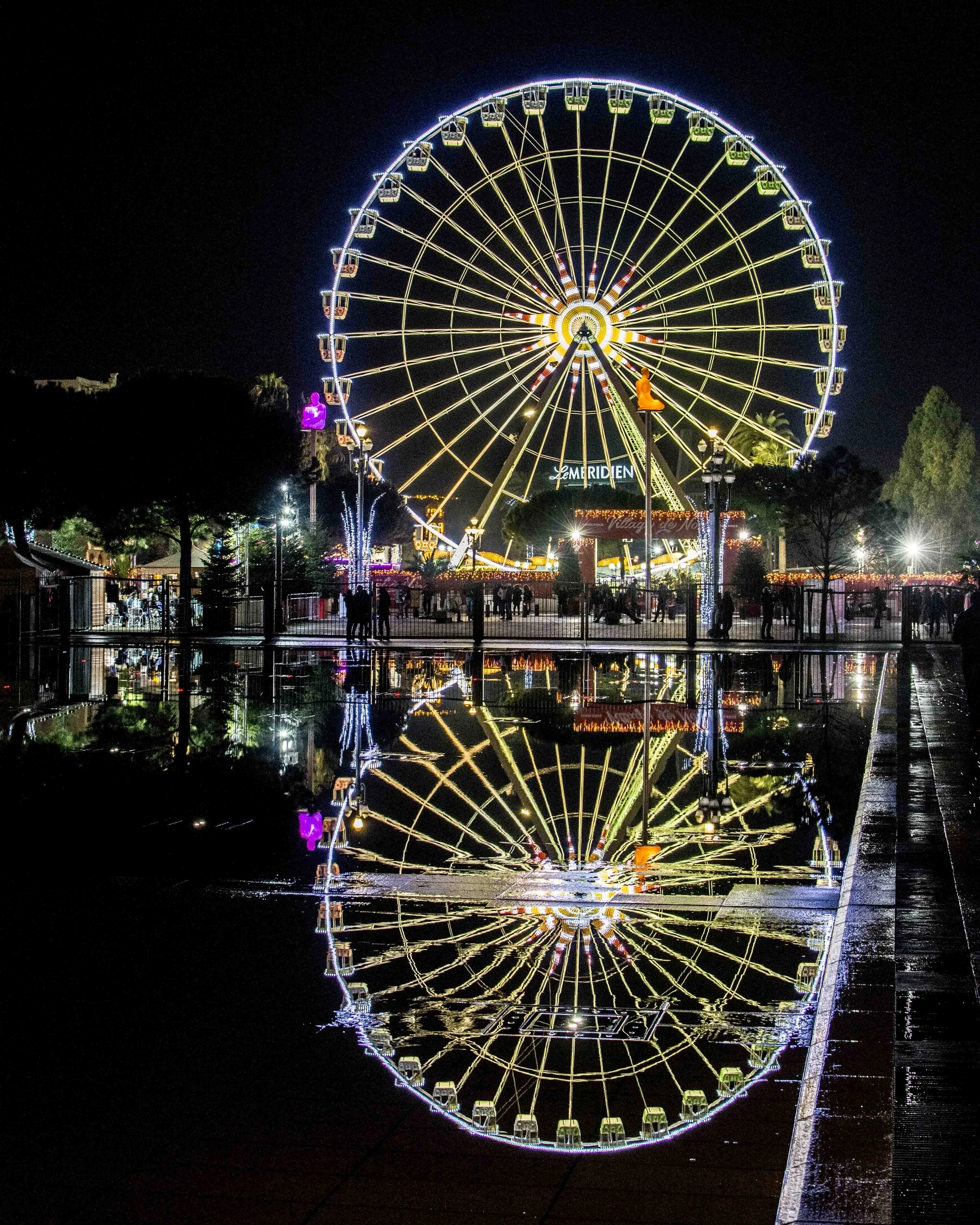 Reflection of Ferris Wheel in Nice.