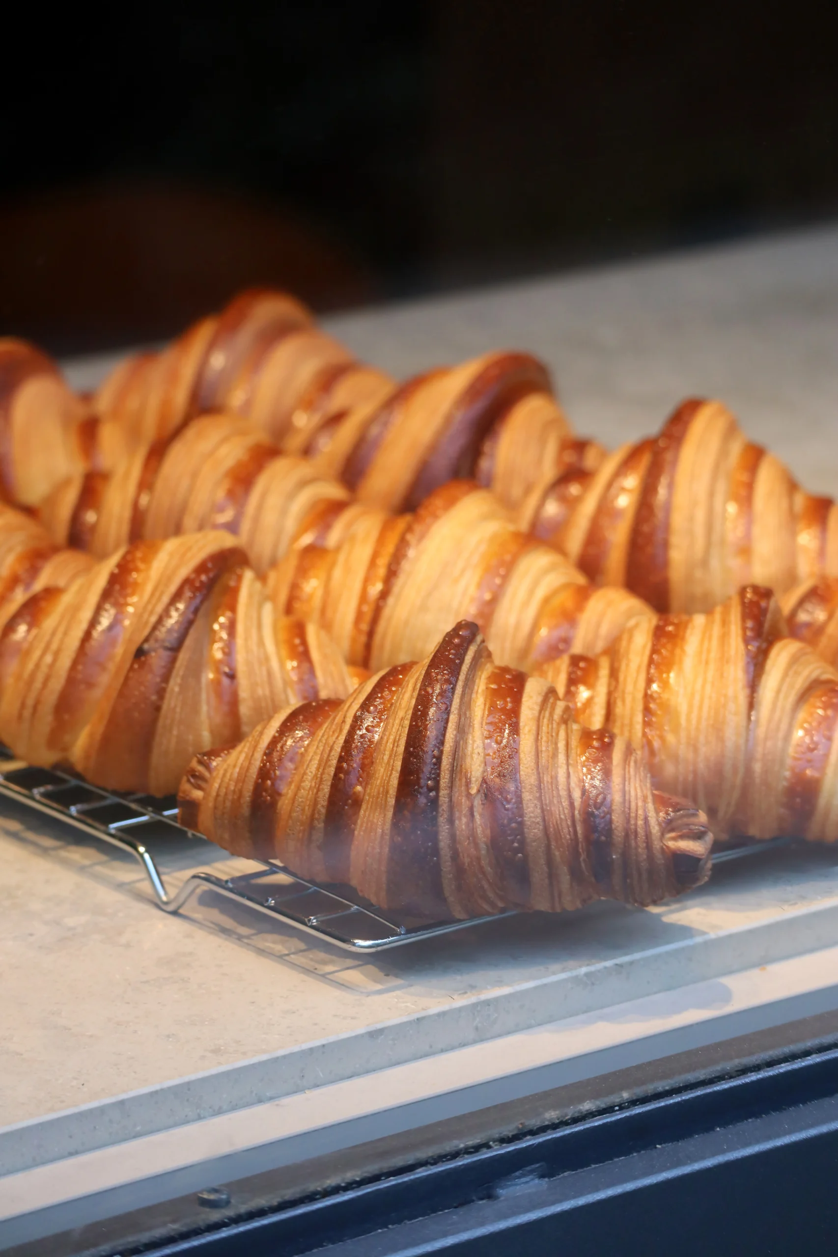 Close-up of fresh and beautiful croissants in a bakery showcase, Nice.
