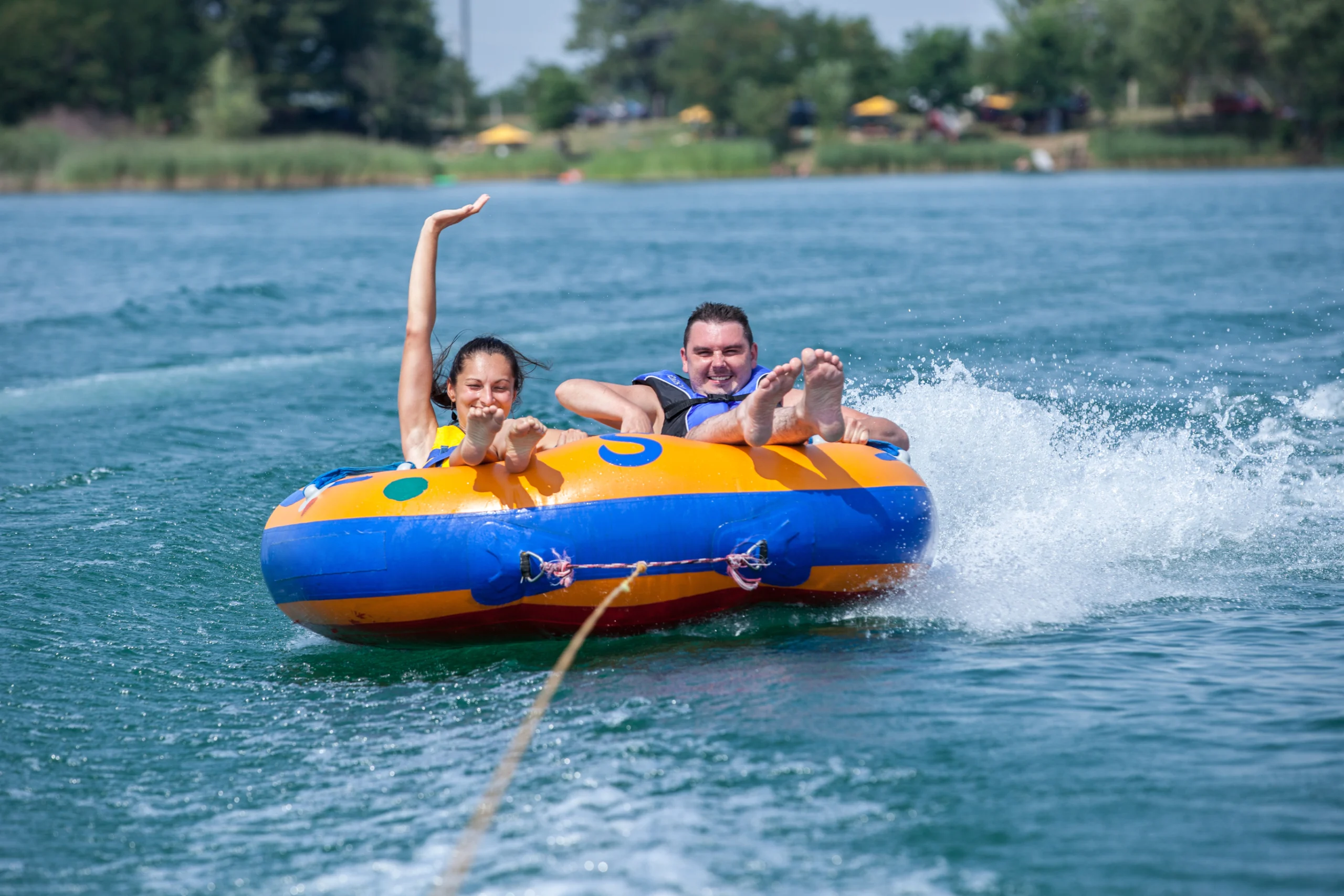 Young couiple on water attractions during summer vacations