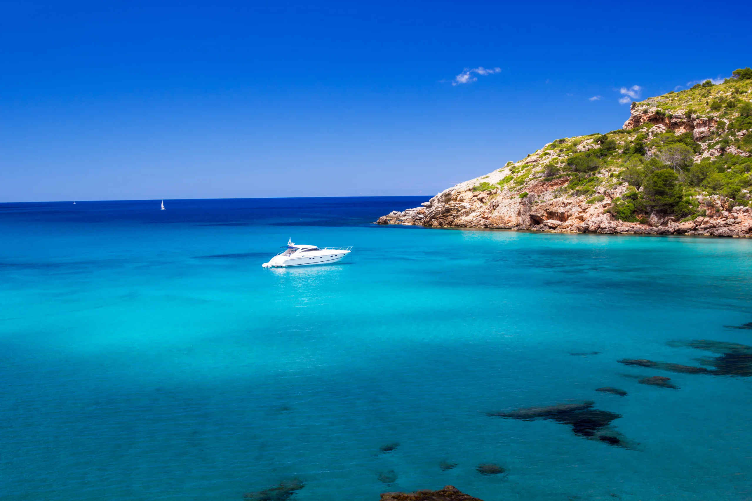 Cala de Algariens seascape in sunny day at Menorca, Spain