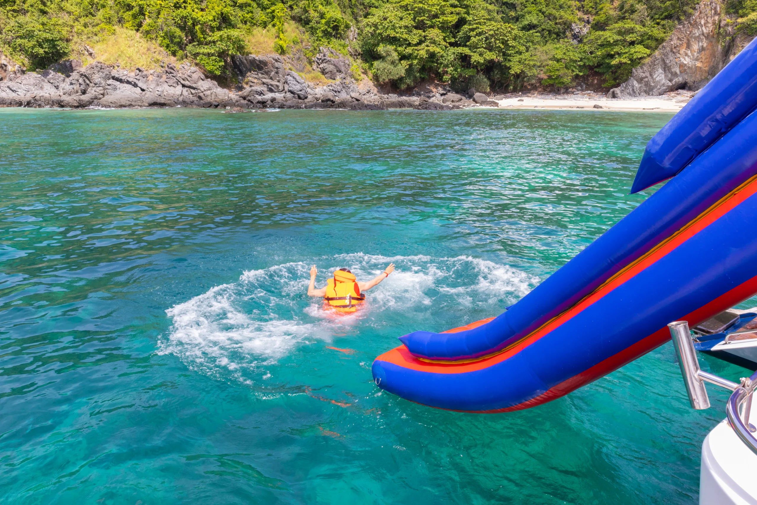 Tourist water slide on yacht cruise at Phuket, Thailand