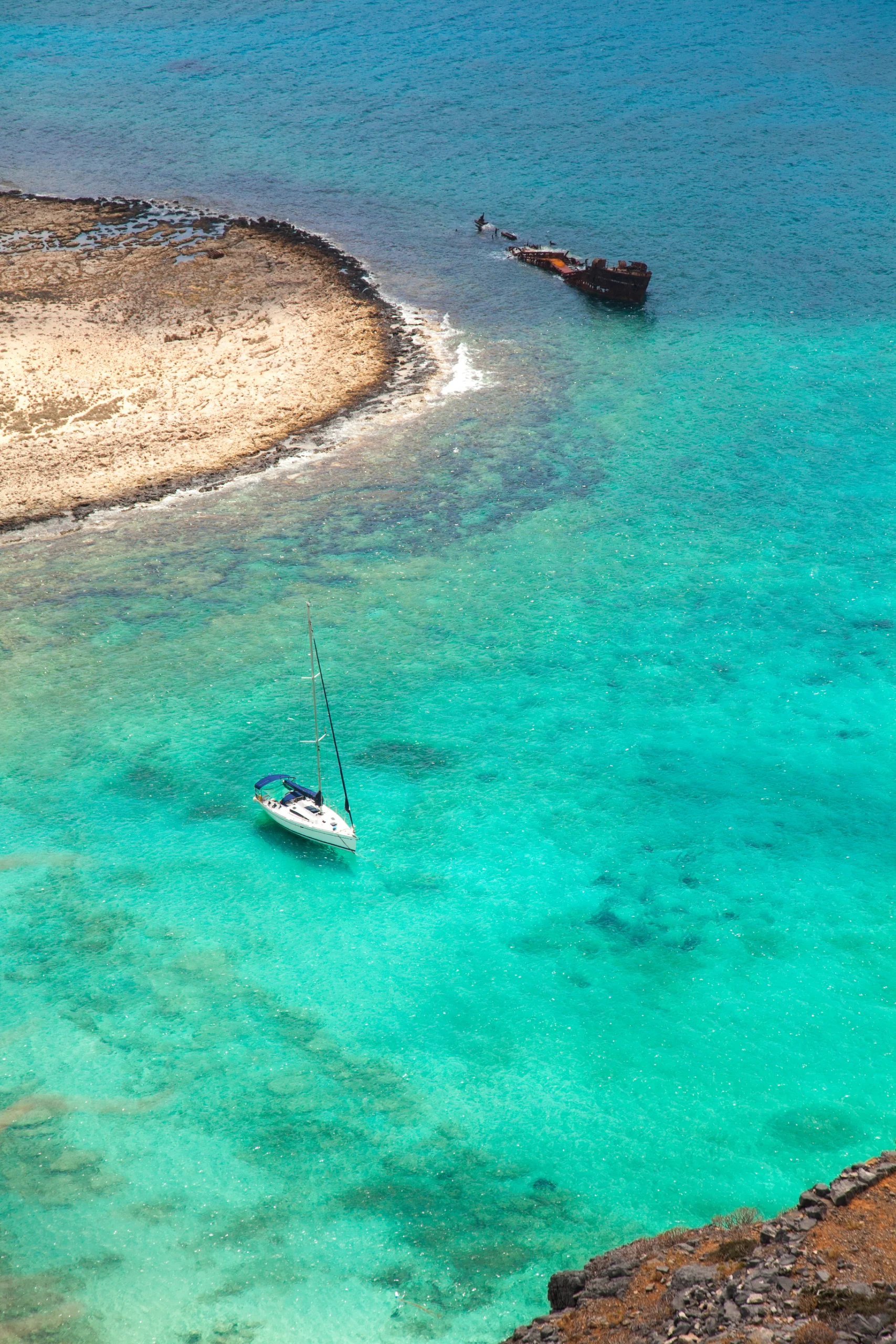 Beautiful tropical lagoon with yacht and pirate ship, Gramvousa island, Greece
