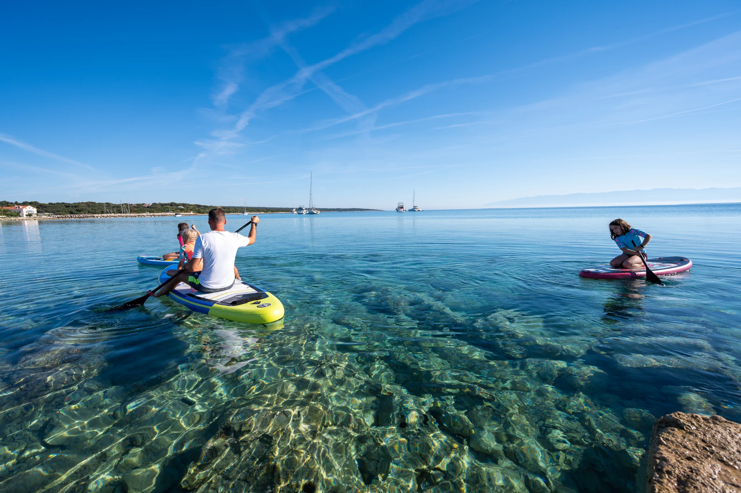 SUP board with yachts in background