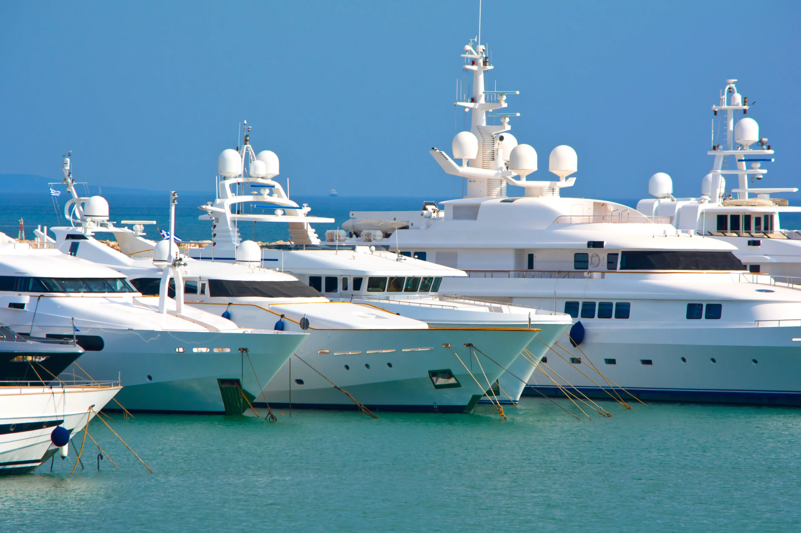 View of luxury yachts at a marina.