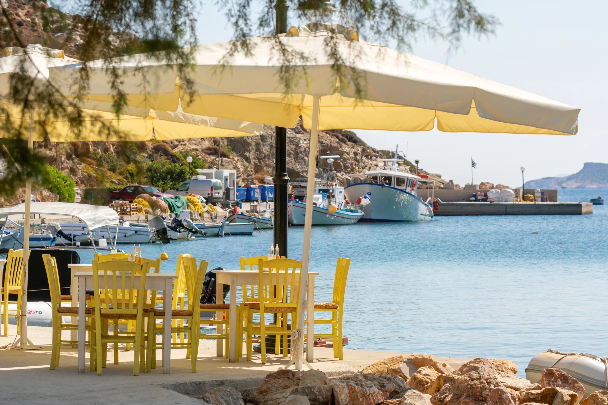 Waterfront Greek tavern in Faros fishing village. Sifnos island, Cyclades, Greece