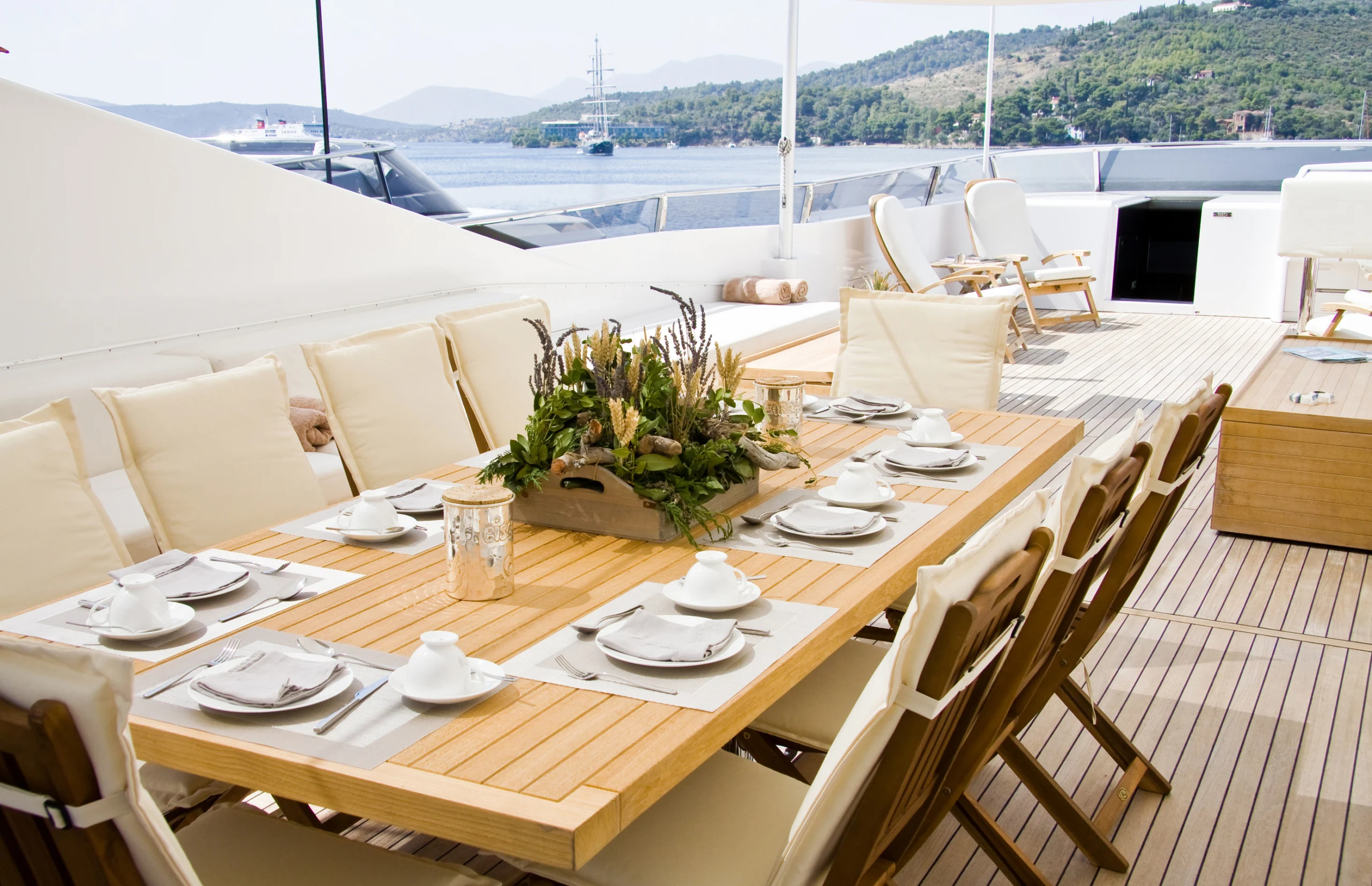 Summer day yacht deck with served table