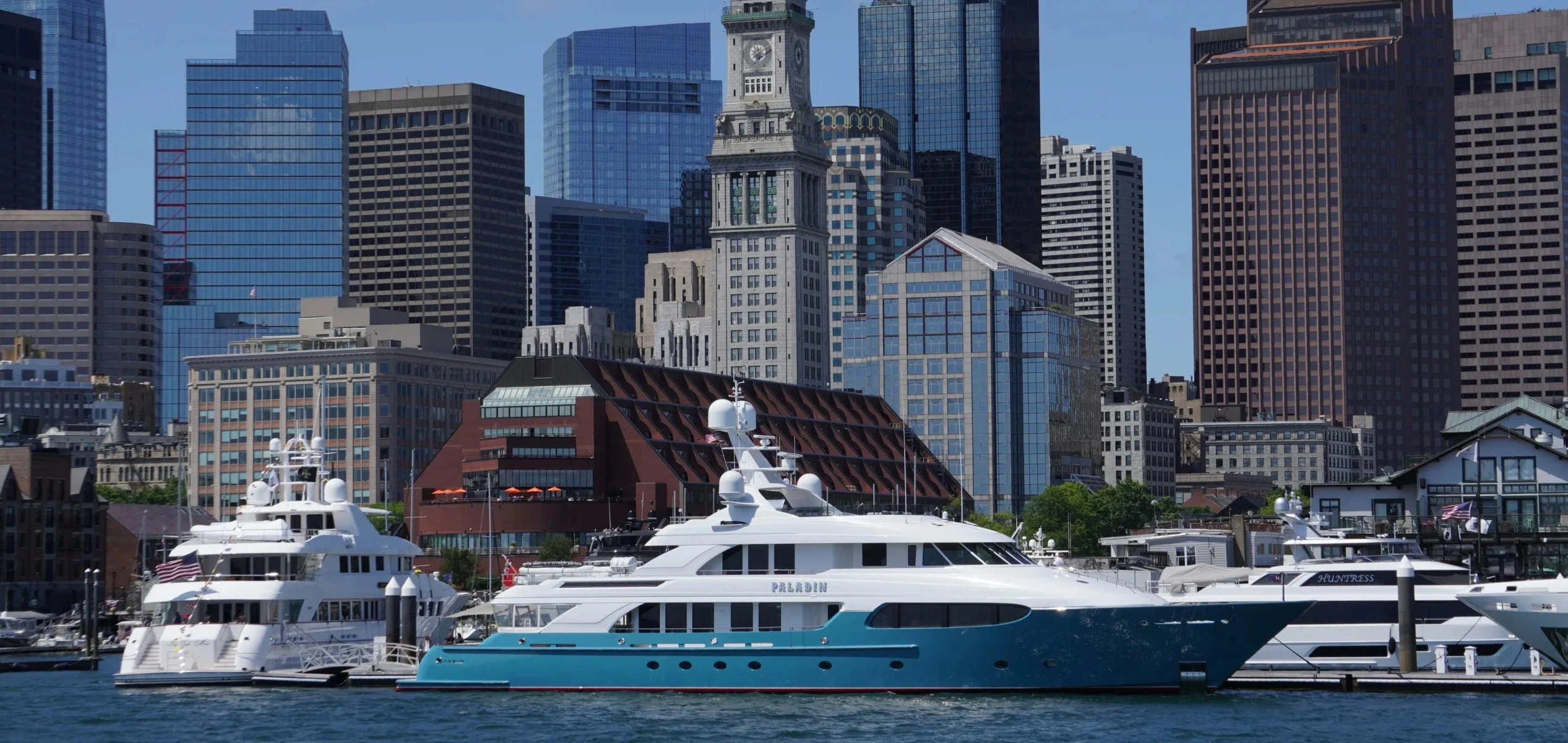 Yachts docked in front of the Boston skyline