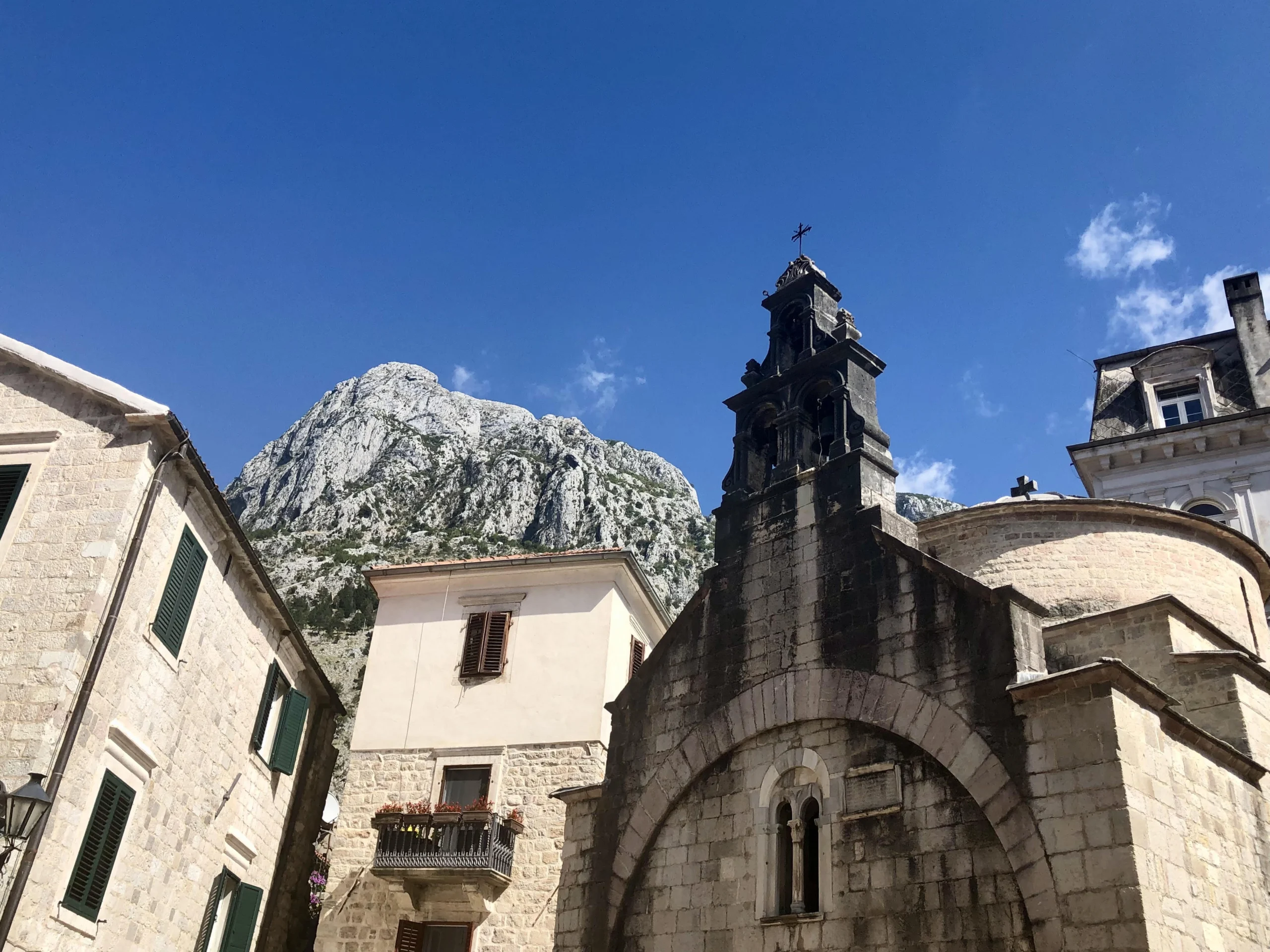 Old Town Kotor St. Tryphon Cathedral with mountains in the backdrop