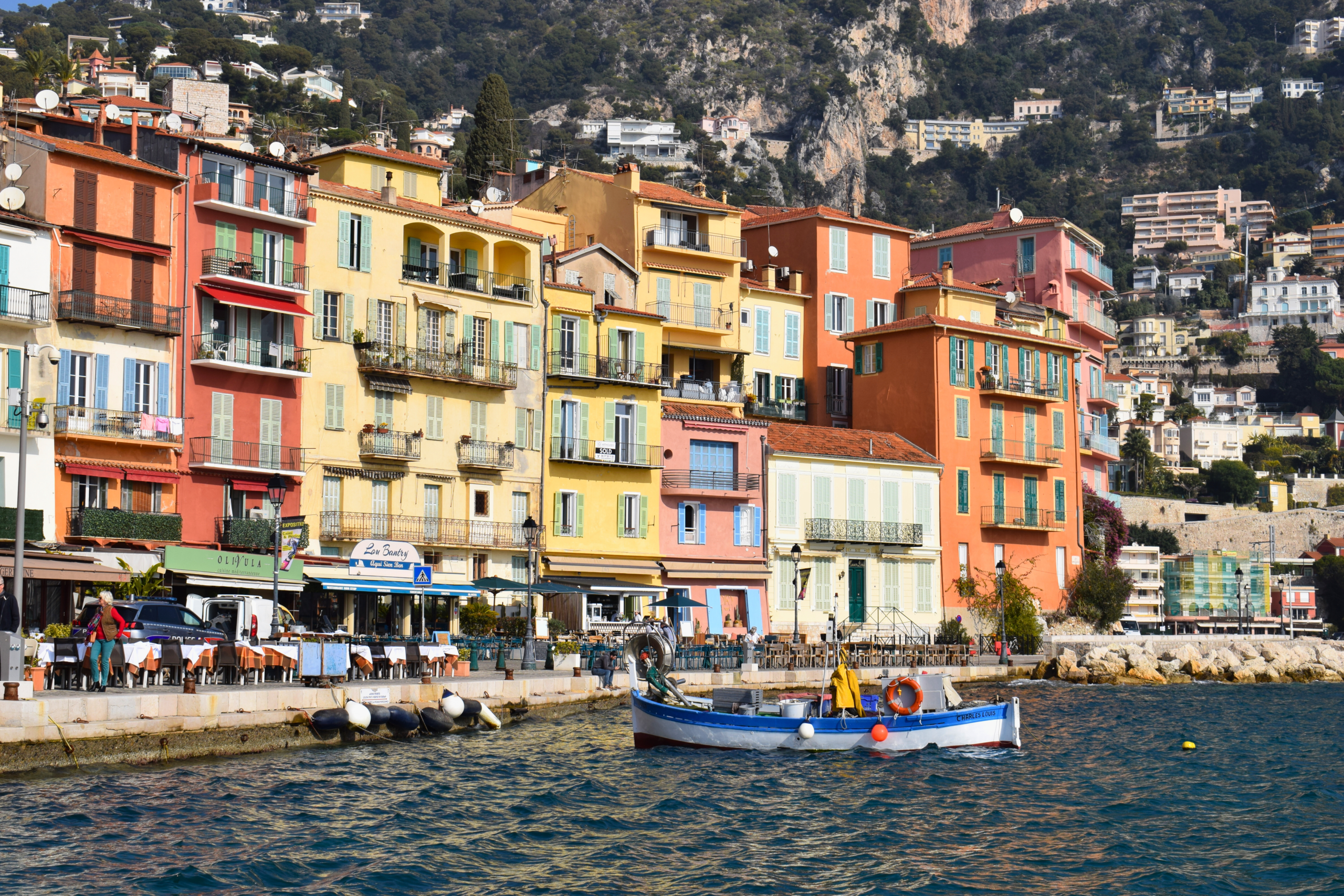 colorful buildings and boats in the water at Villefranche