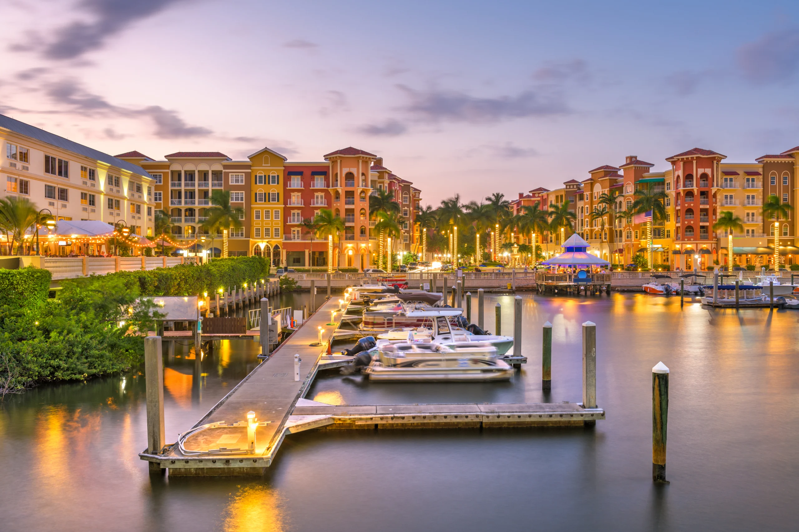 Naples, Florida, USA town skyline on the water at dusk