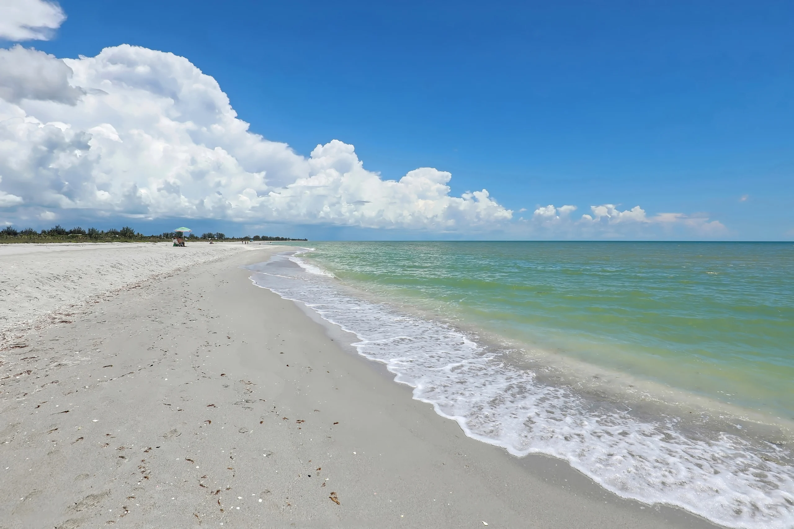 The beach on Sanibel Island, Florida. Dramatic clouds gathering over Sanibel Island sandy beaches in Florida, United States.