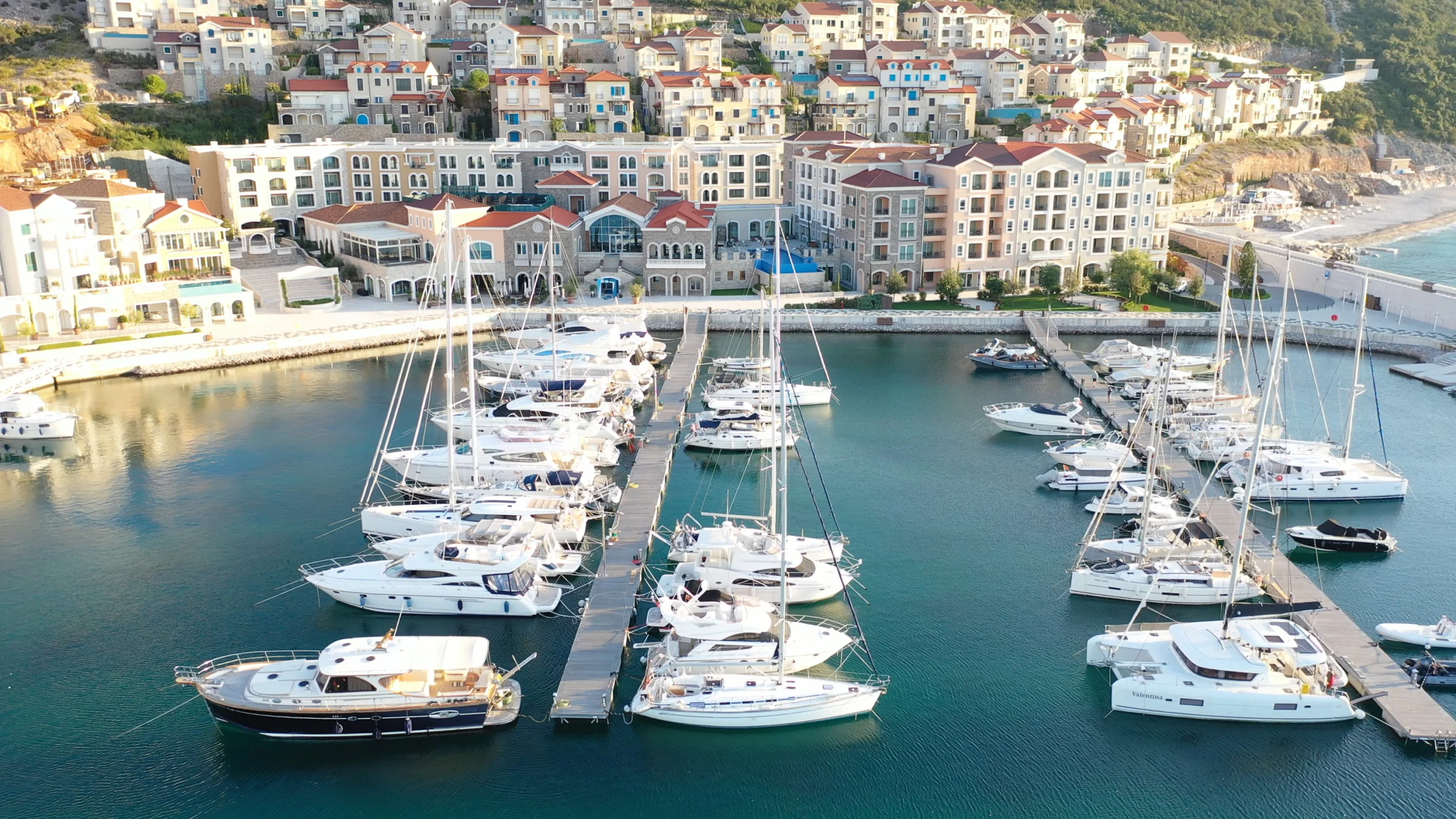 Aerial view of Lustica Bay marina with its luxury boats and yachts in Montenegro