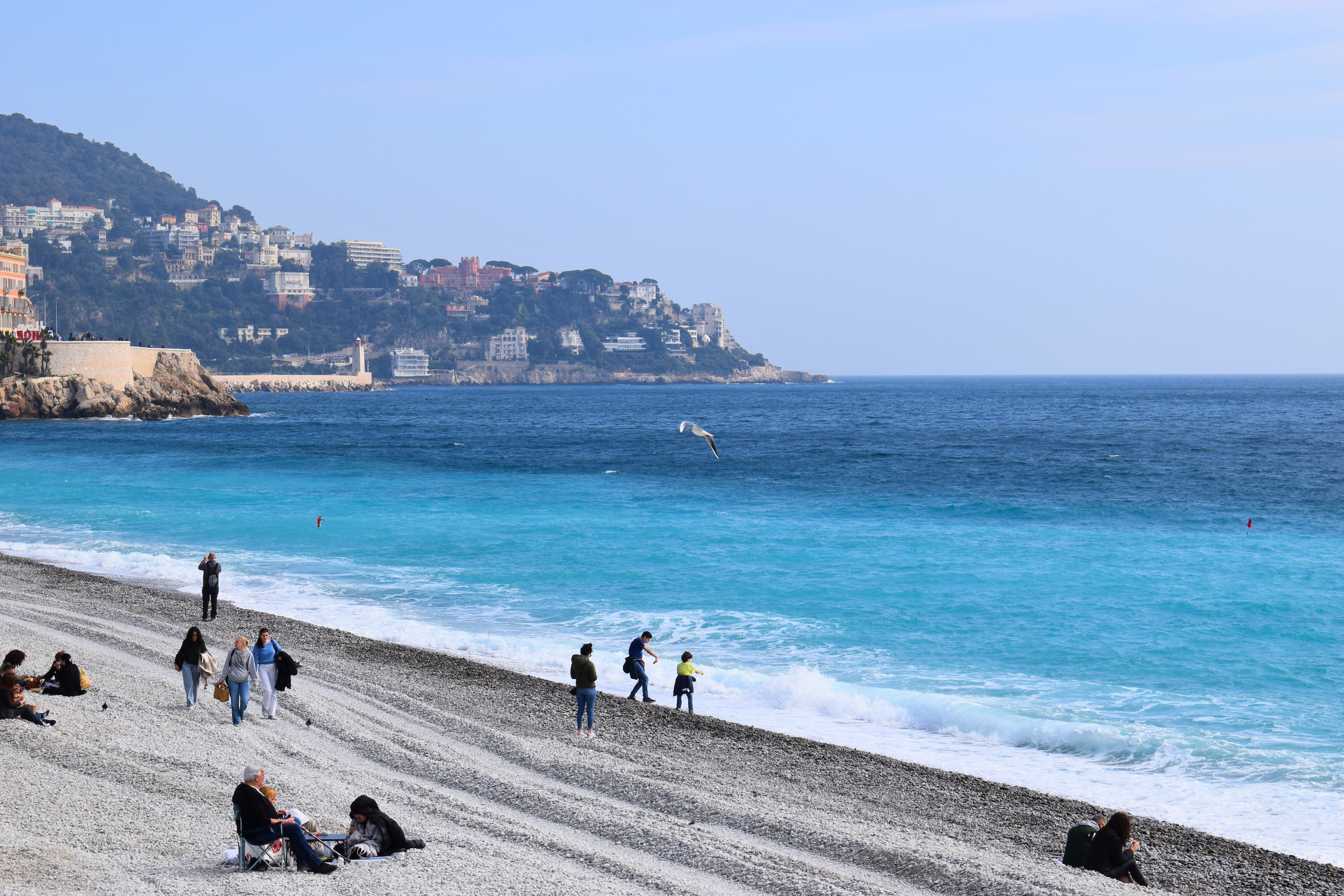 people walking along the coast in Nice, France
