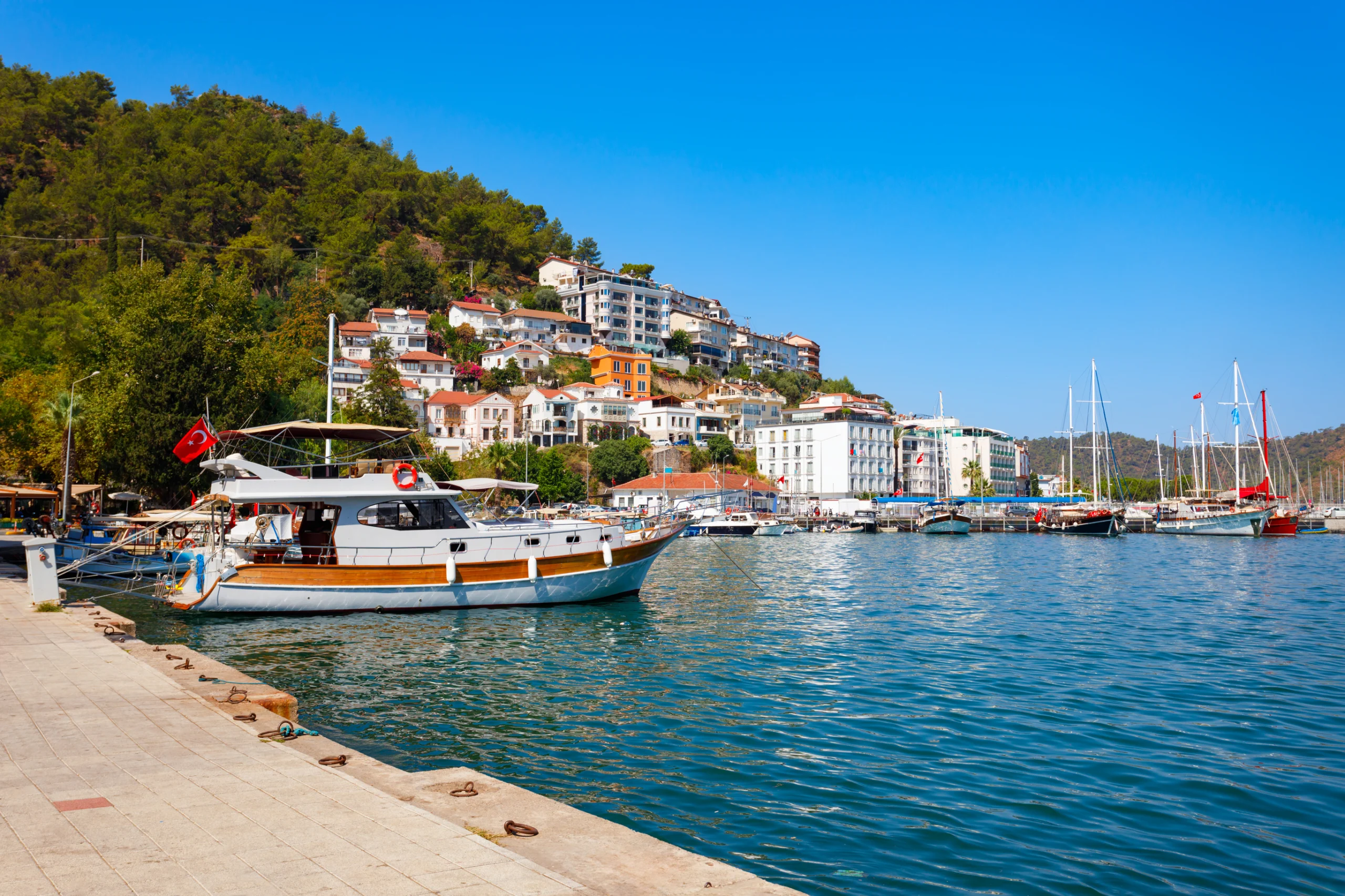 Fethiye port in the centre of Fethiye city, Turkey. Boats at the Fethiye port. Fethiye is a city in Mugla Province, Turkey