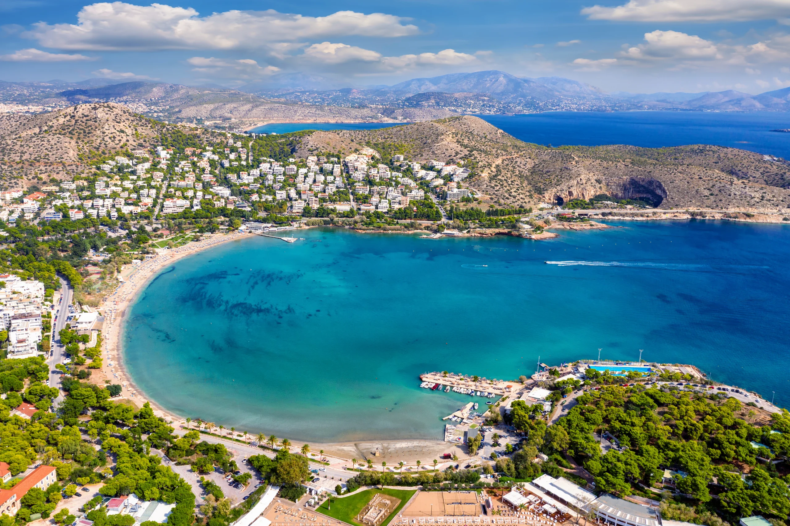 Aerial view of Vouliagmeni beach on Athens, Greece. Aerial view of the picturesque Vouliagmeni beach on the south coast riviera of Athens, Greece, during summer time