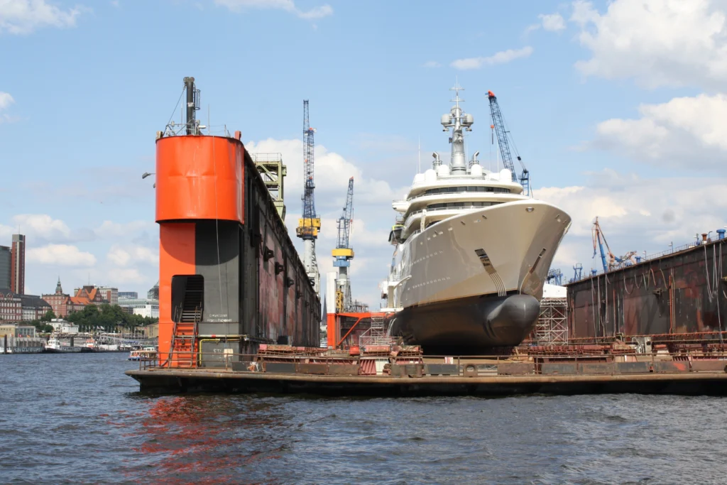 Luxury yacht in dry dock at a Hamburg shipyard on the Elbe